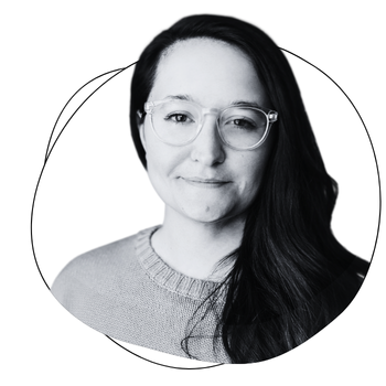 Black and white headshot of Cait
